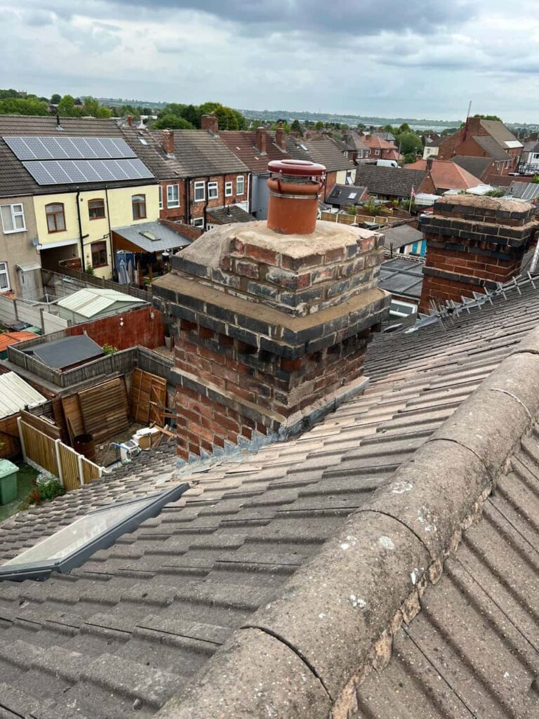 This is a photo taken from a roof which is being repaired by Portsmouth Roofing Repairs, it shows a street of houses, and their roofs