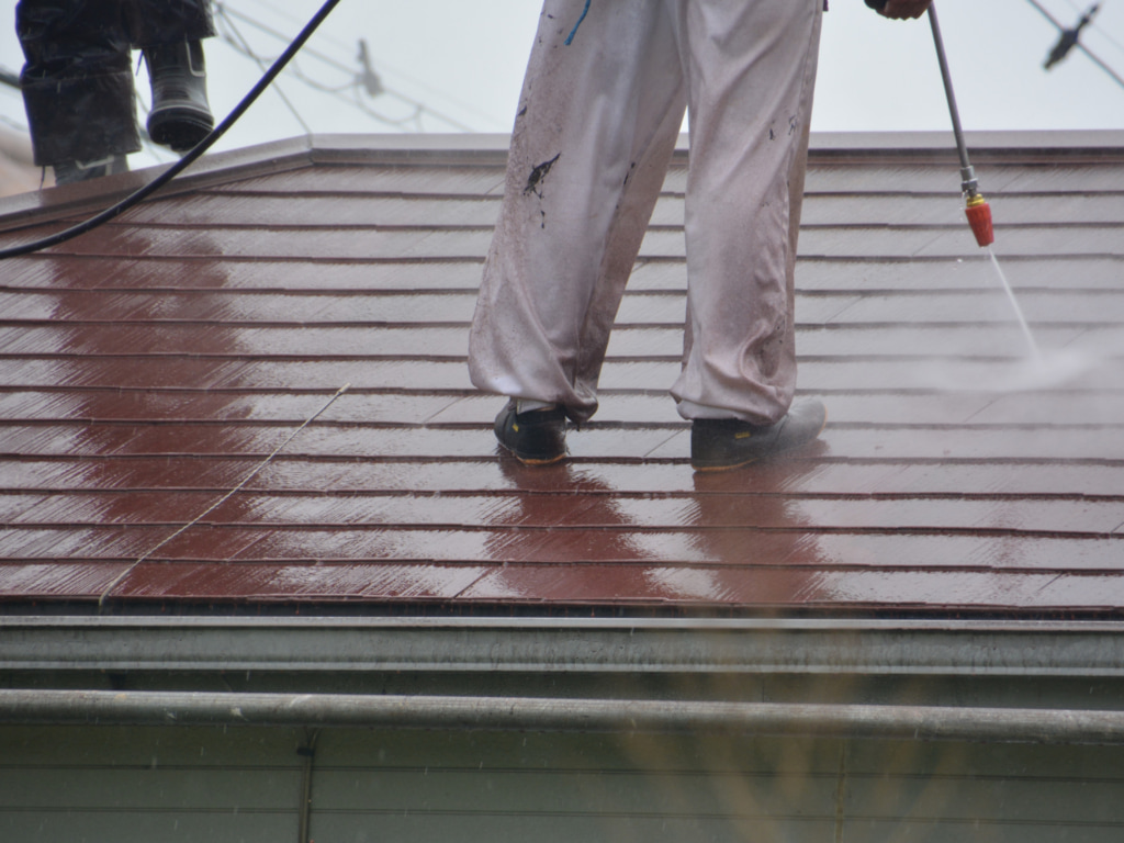 Roof cleaning using a power washer